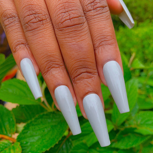 May include: Long, gray, coffin-shaped acrylic nails with a glossy finish